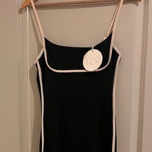 Elegant Black Dress with Cream Accents